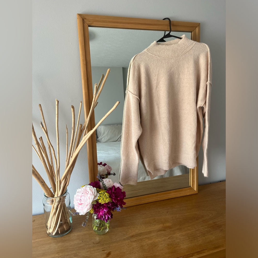 Cream mock-neck sweater. Size medium.